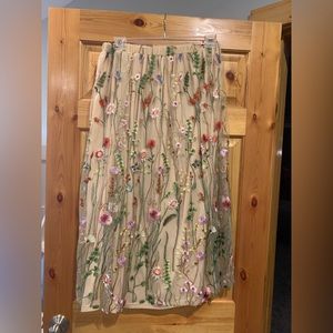 Skirt with floral overlay